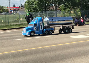 A small parade version of Liquids in Motion Ltd. bulk water hauling trick for the Leduc Black Pro Rodeo Parade.