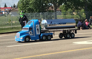Small version of a liquids in motions water hauling truck taking part in Leduc Black Gold Pro Rodeo's parade