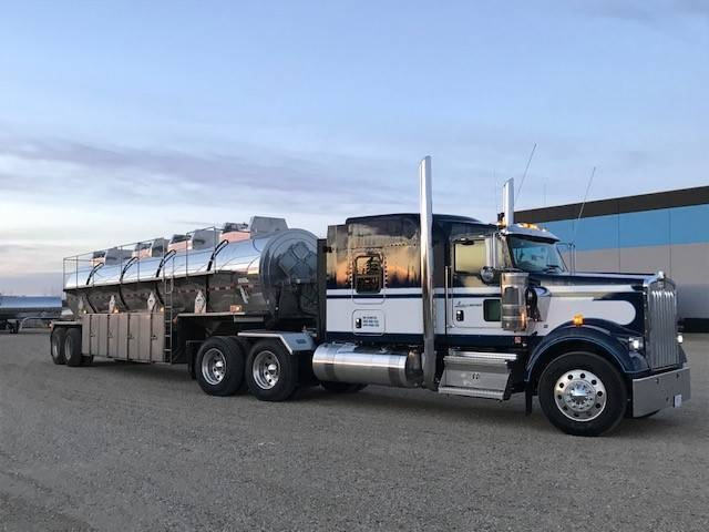 Liquids in Motion Ltd. liquid transporting truck posed in parking lot.